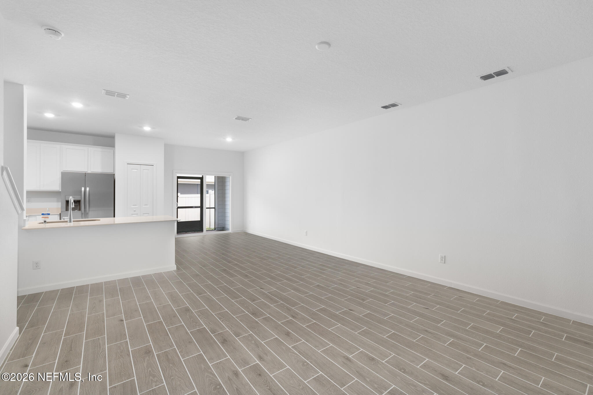 25 Craig Court St. Augustine, FL 32092 - Photo 7 of 25 a view of a kitchen with wooden floor and a sink