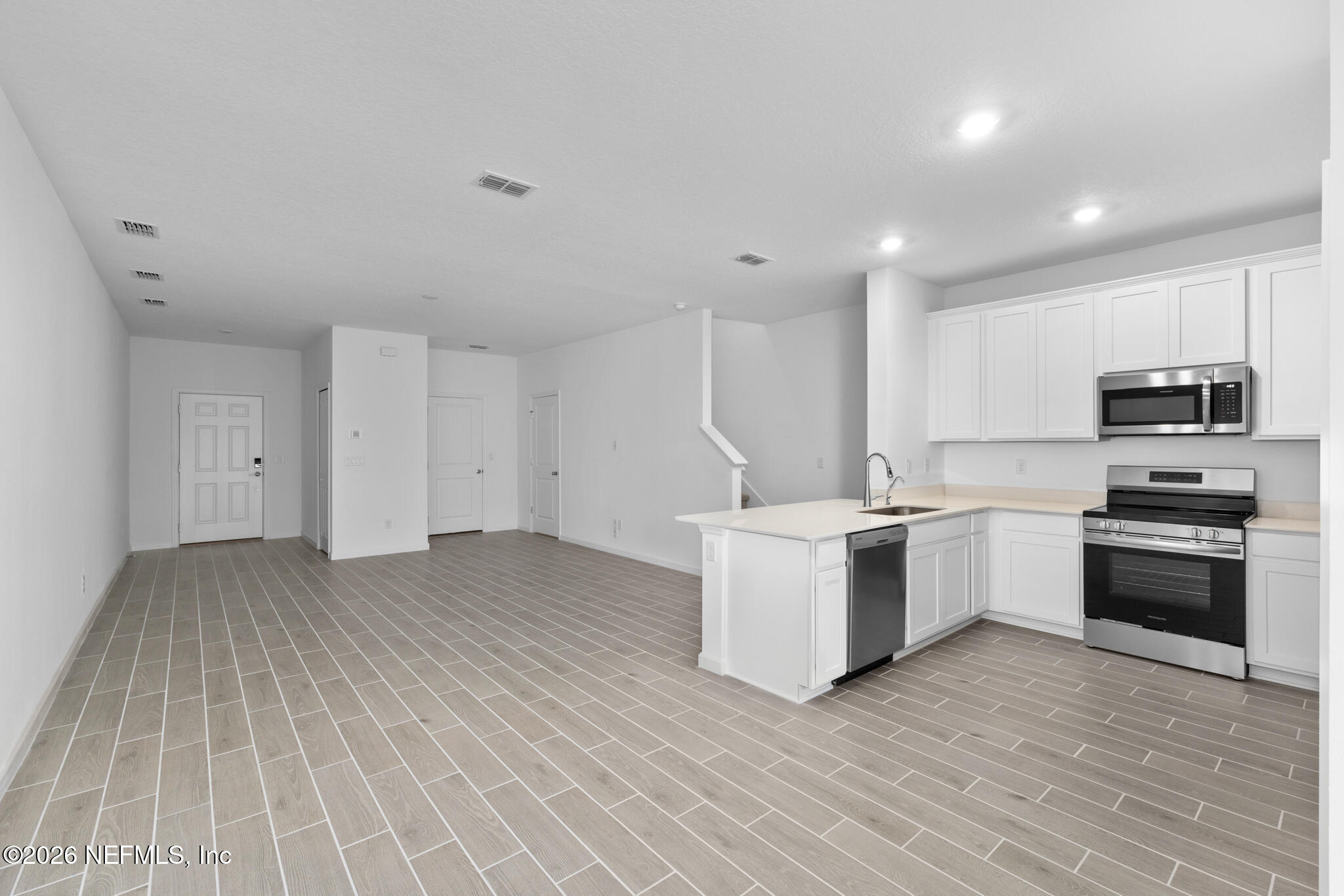 25 Craig Court St. Augustine, FL 32092 - Photo 8 of 25 a kitchen with a sink cabinets and stainless steel appliances