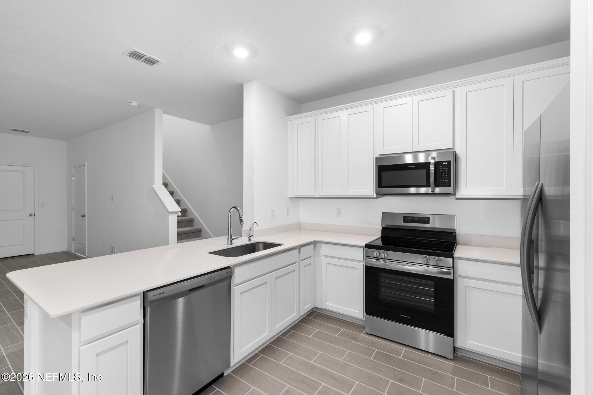 25 Craig Court St. Augustine, FL 32092 - Photo 10 of 25 a kitchen with a sink appliances and cabinets