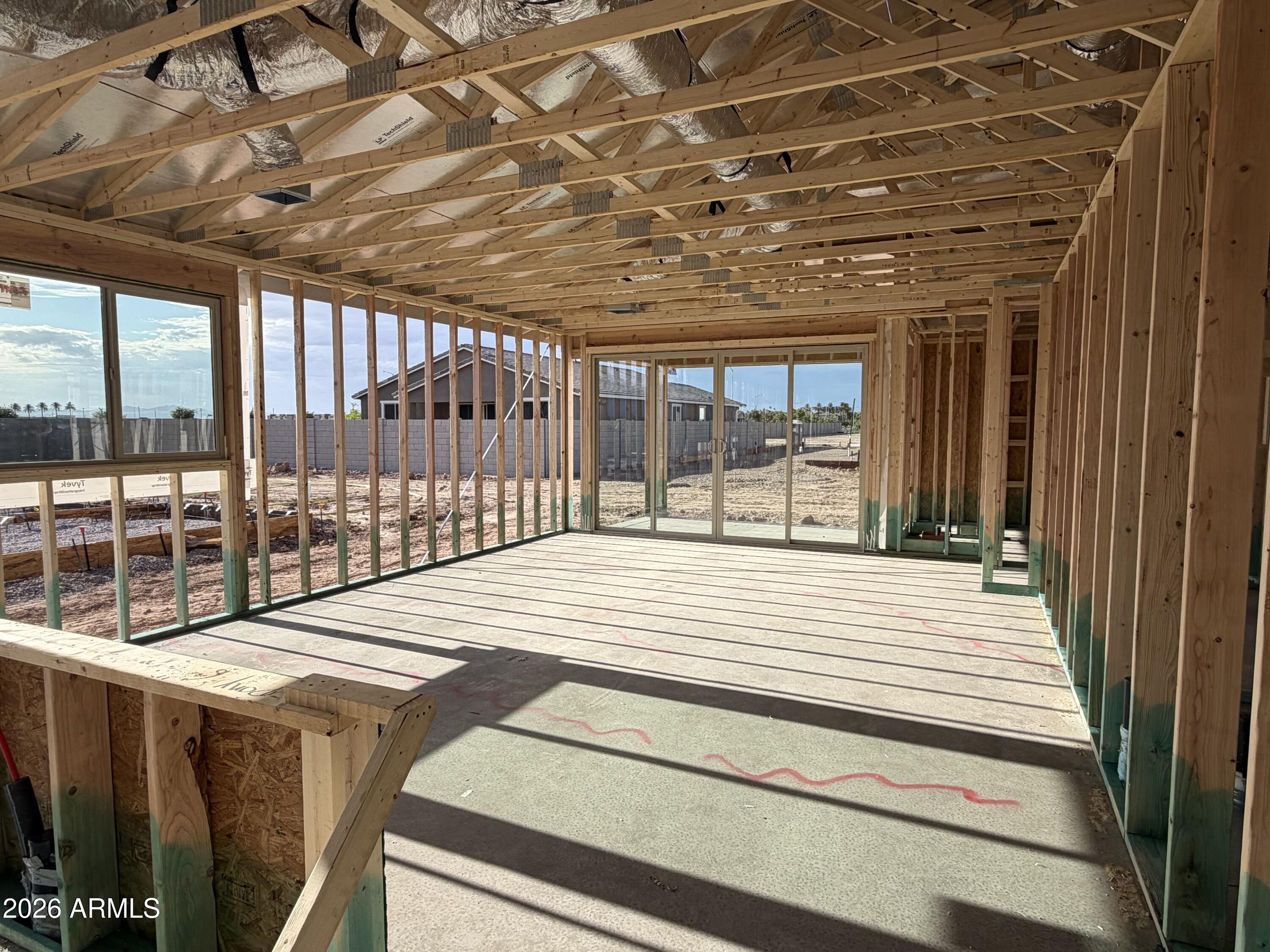 5630 West Piedmont Road Laveen, AZ 85339 - Photo 4 of 20 a bedroom with a bed and large windows