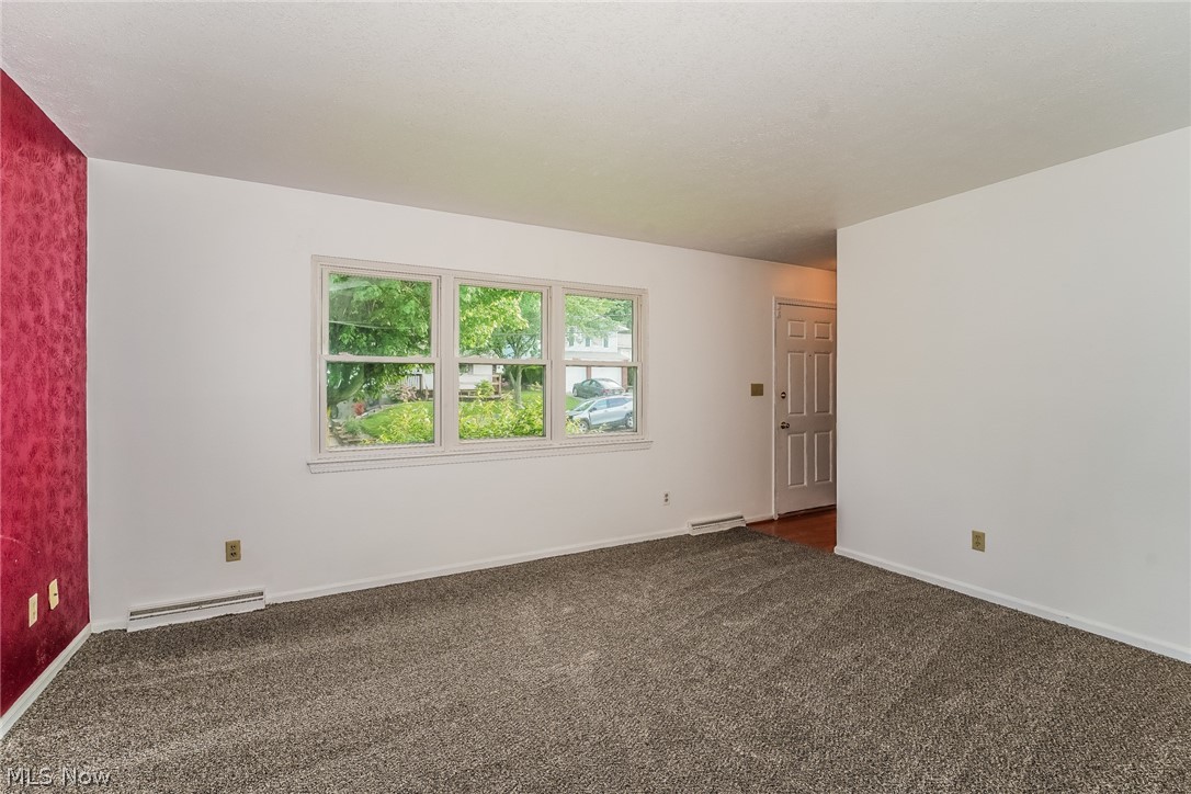 2508 Primewood Road Akron, OH 44305 - Photo 3 of 20 Carpeted spare room featuring a baseboard radiator
