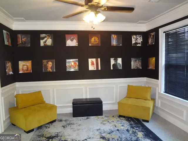 a living room with furniture and a rug