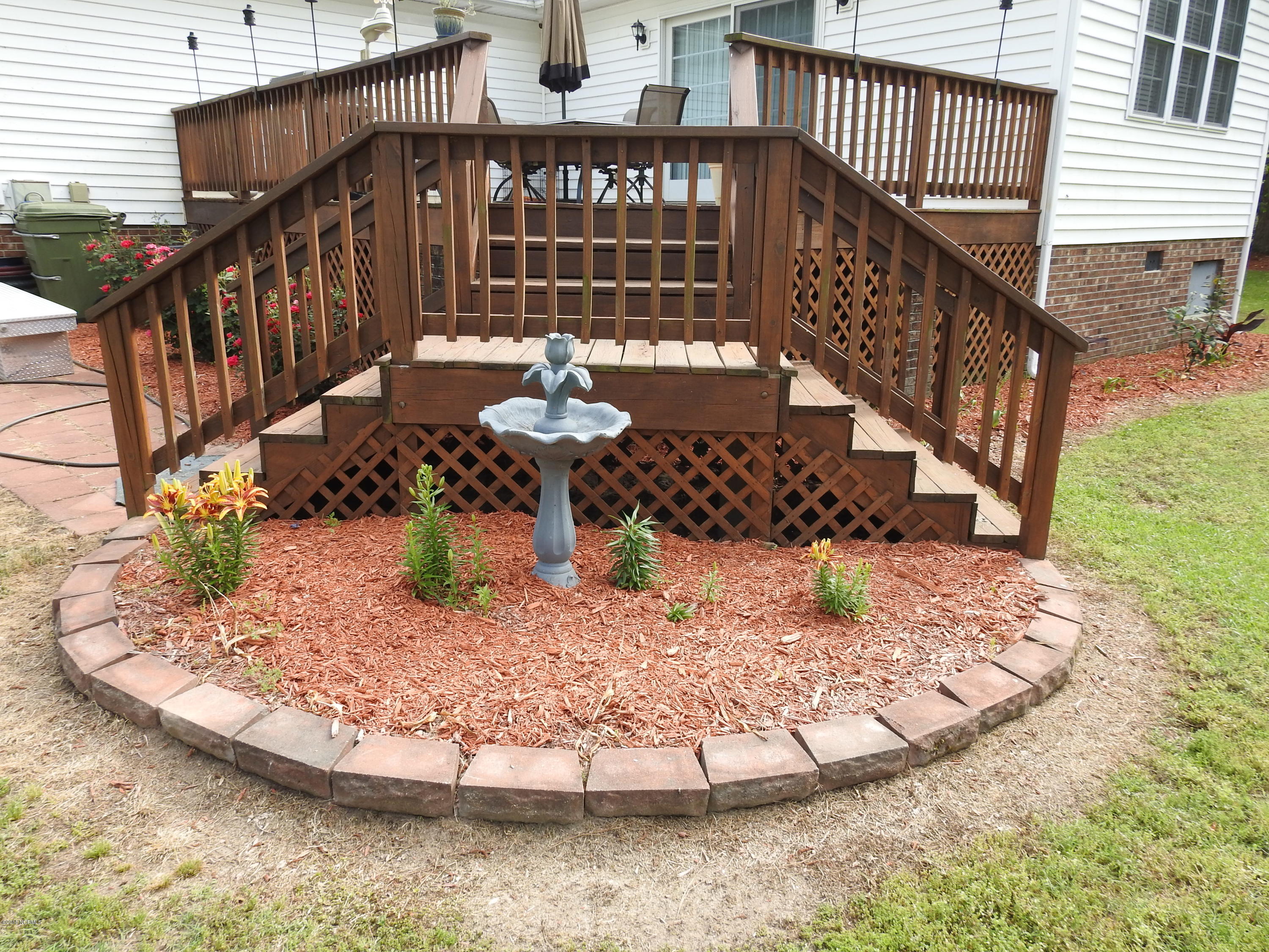 3865 Edwards Road Grimesland, NC 27837 - Photo 29 of 38 Landscaping around Deck