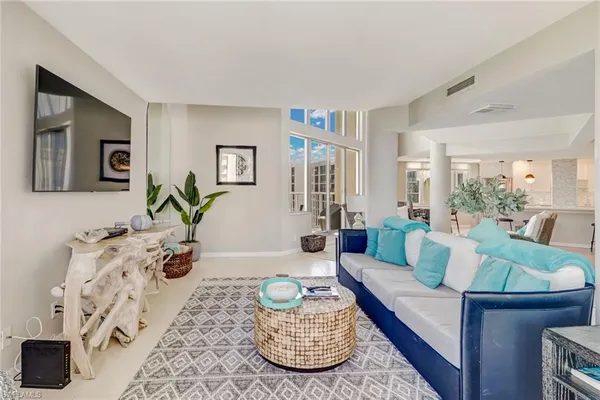 a living room with furniture and a rug