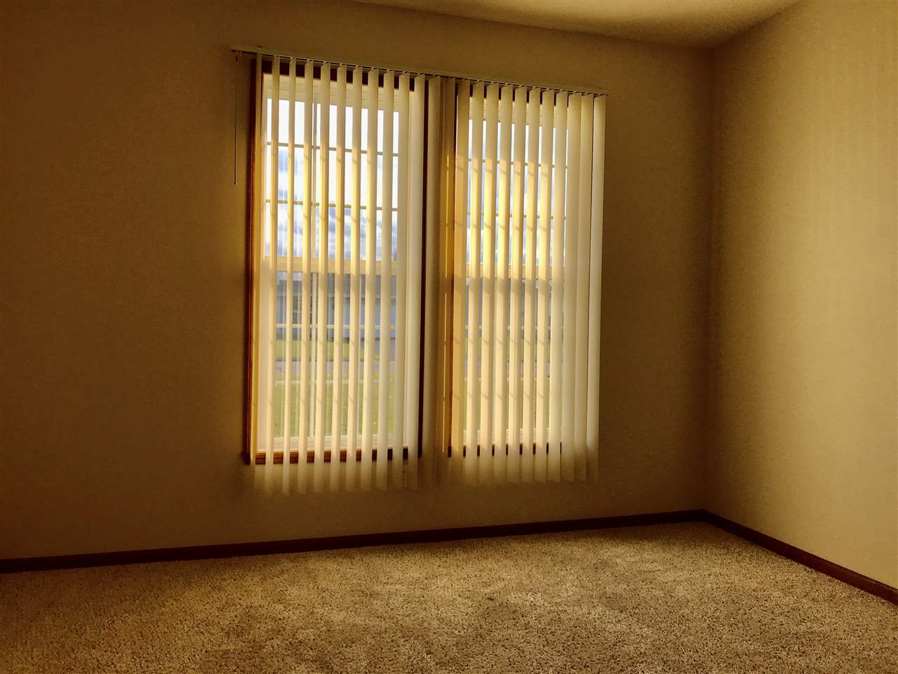 15612 Stonecrest Road South Beloit, IL 61080 - Photo 11 of 14 a view of an empty room with a window