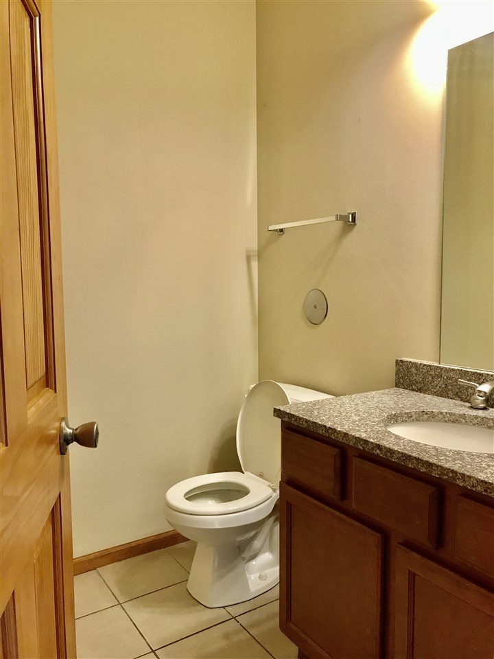 15612 Stonecrest Road South Beloit, IL 61080 - Photo 12 of 14 a bathroom with a granite countertop toilet and a sink