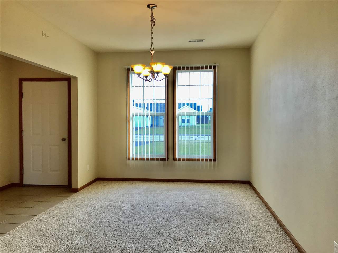 15612 Stonecrest Road South Beloit, IL 61080 - Photo 4 of 14 a view of an empty room with a window