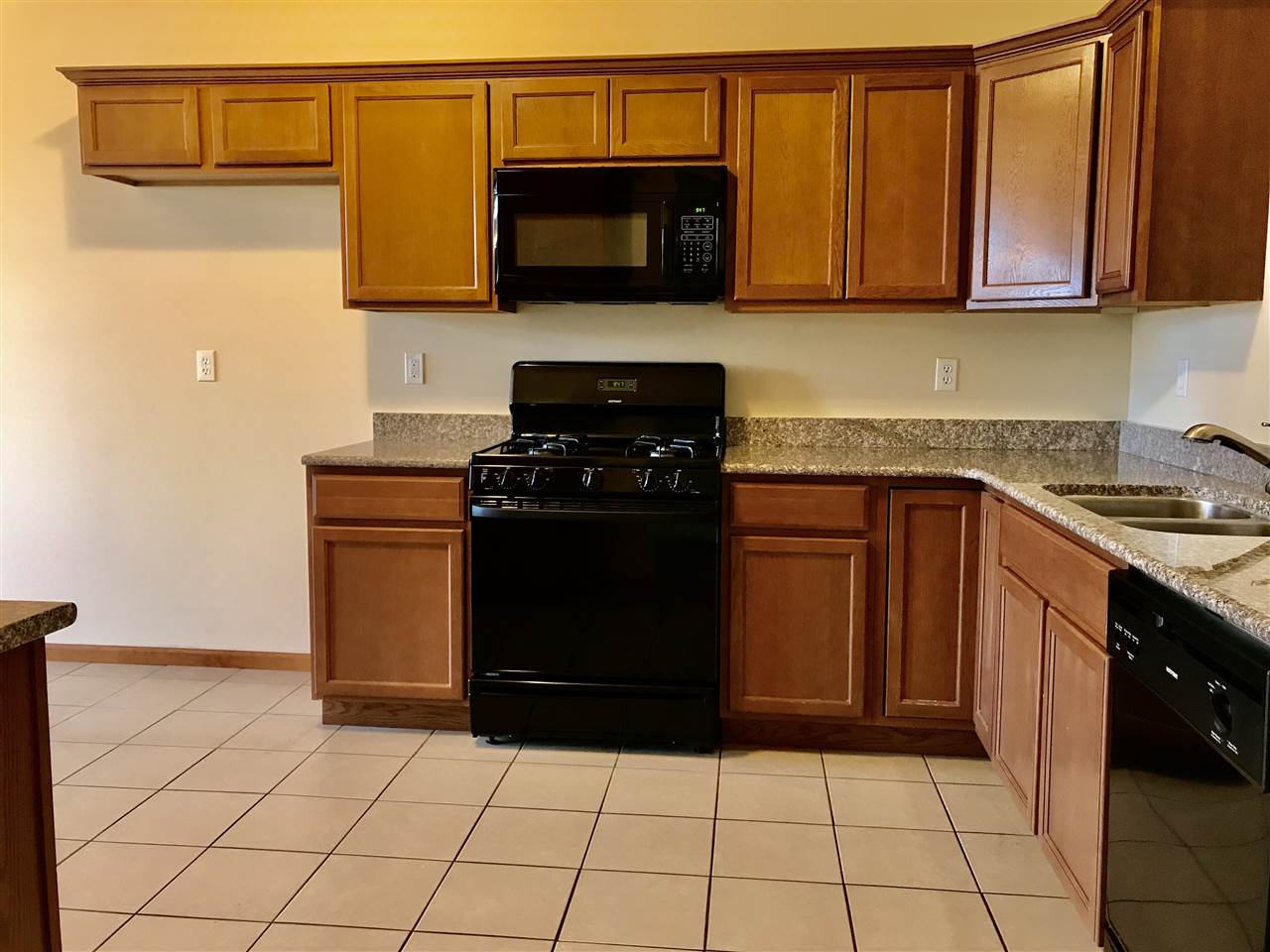15612 Stonecrest Road South Beloit, IL 61080 - Photo 5 of 14 a kitchen with a sink and a stove