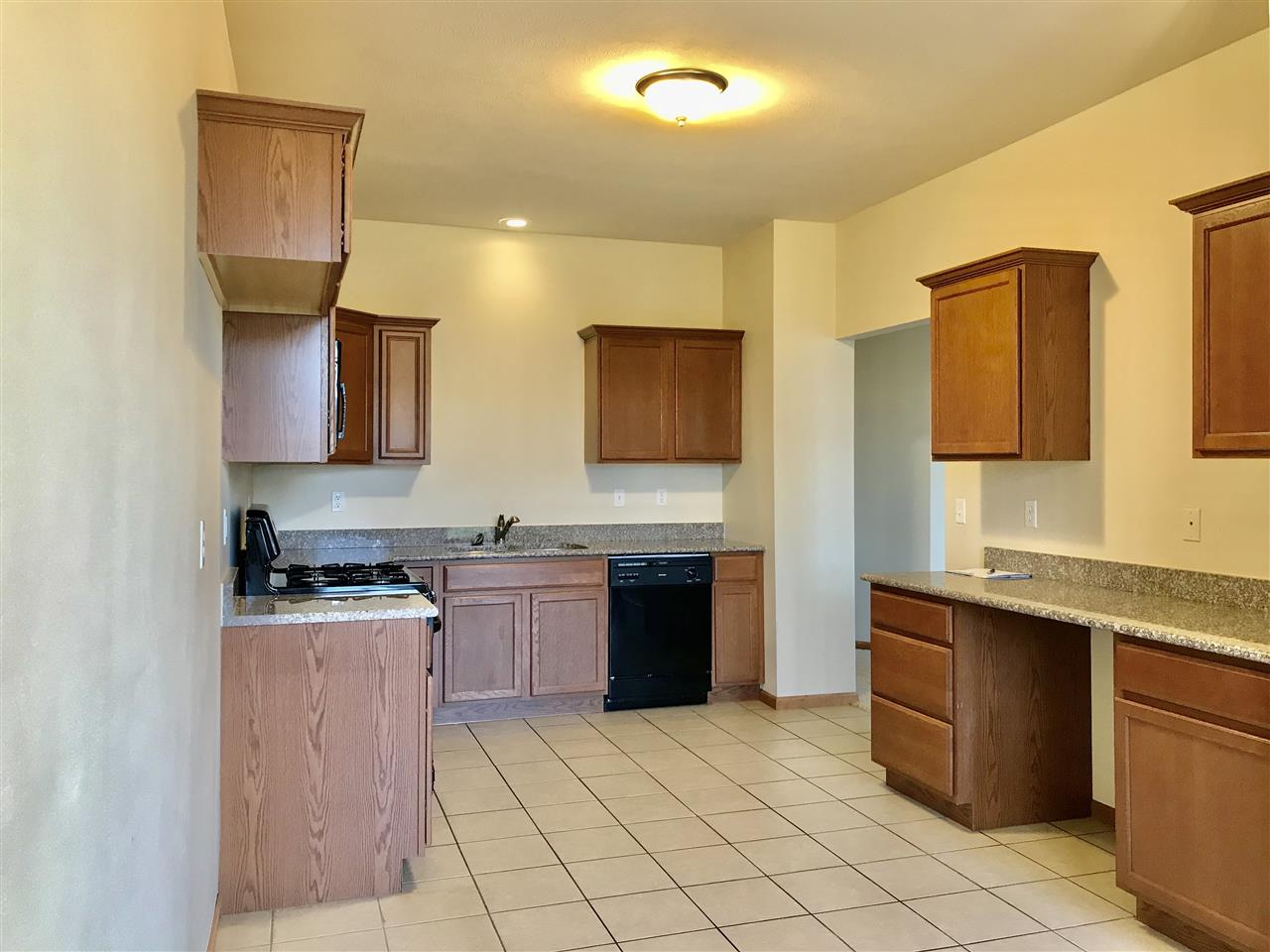 15612 Stonecrest Road South Beloit, IL 61080 - Photo 6 of 14 a kitchen with stainless steel appliances granite countertop a sink and a stove