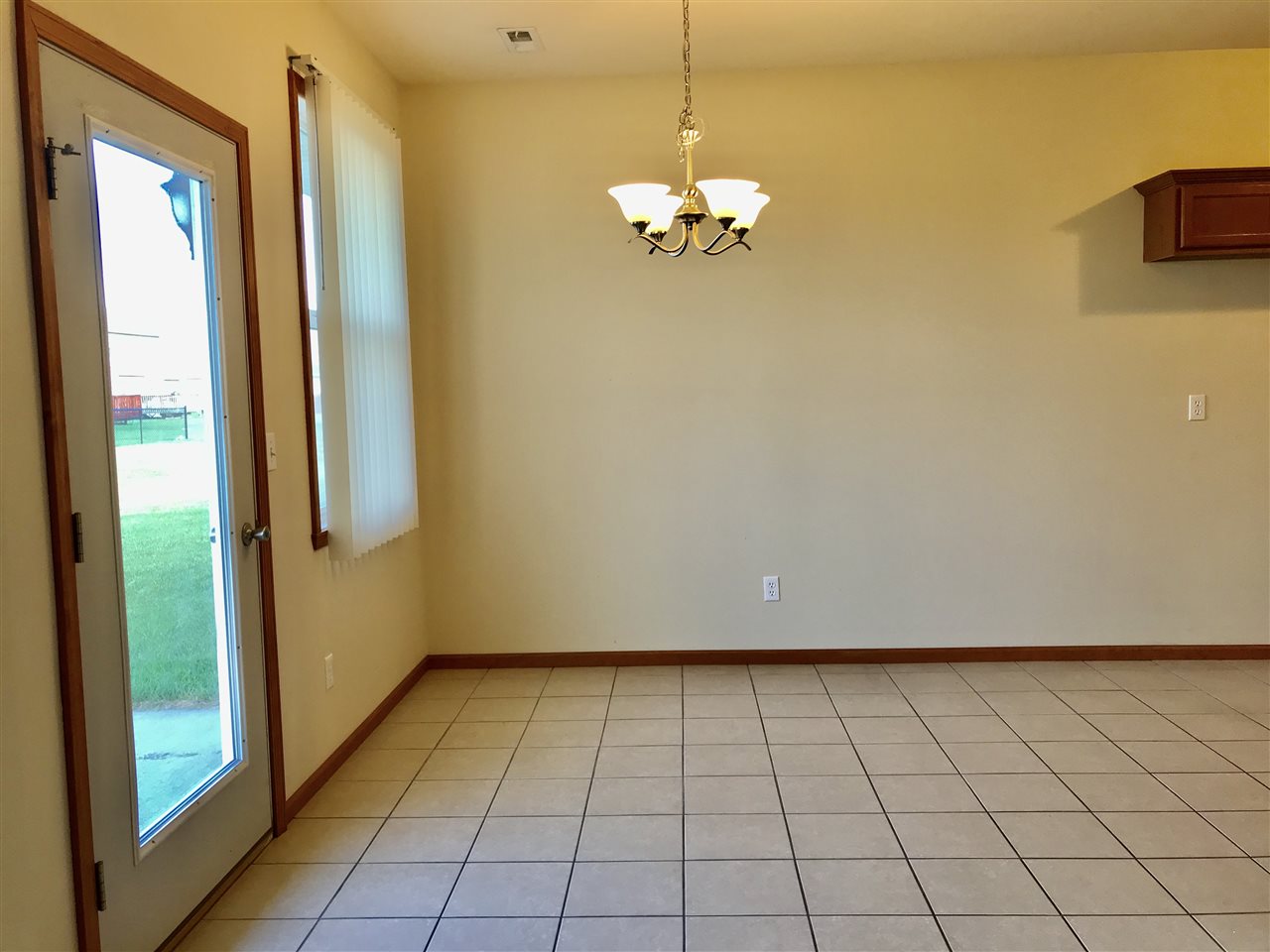 15612 Stonecrest Road South Beloit, IL 61080 - Photo 7 of 14 a view of an empty room with chandelier