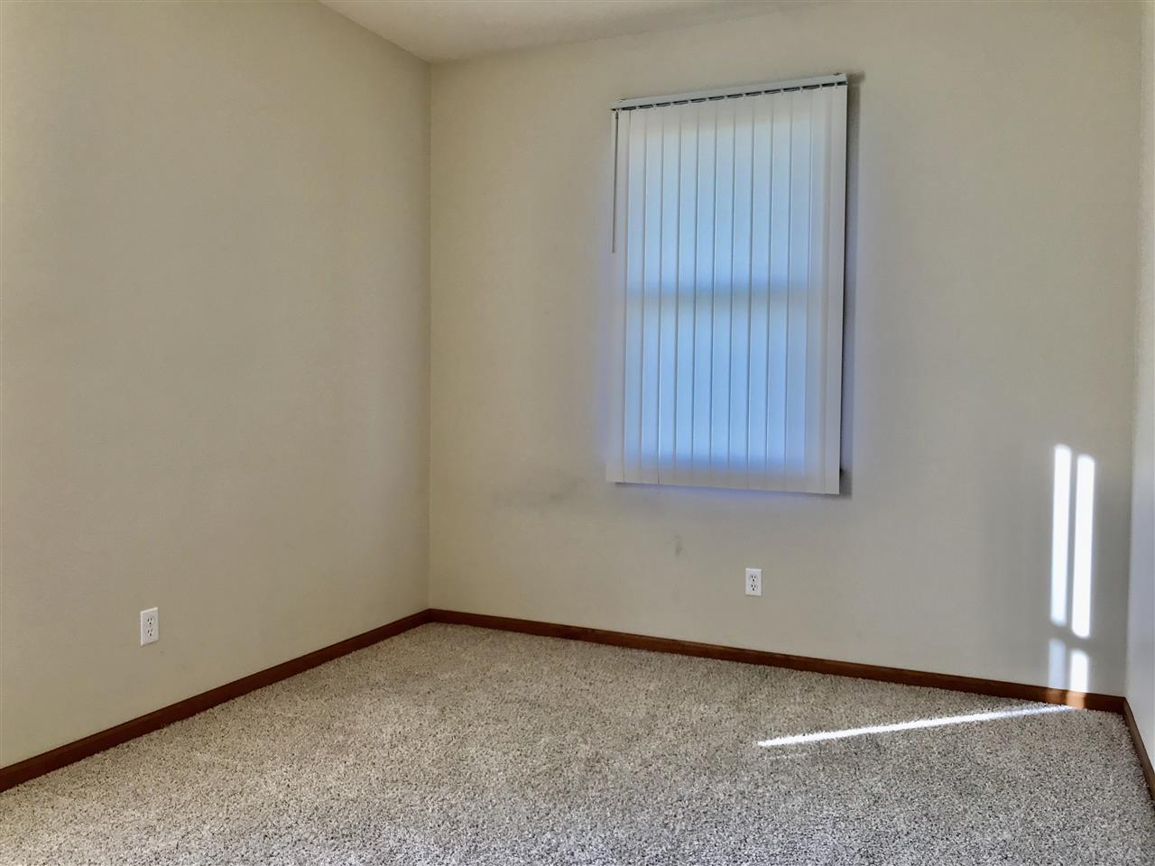 15612 Stonecrest Road South Beloit, IL 61080 - Photo 10 of 14 a view of an empty room with a window