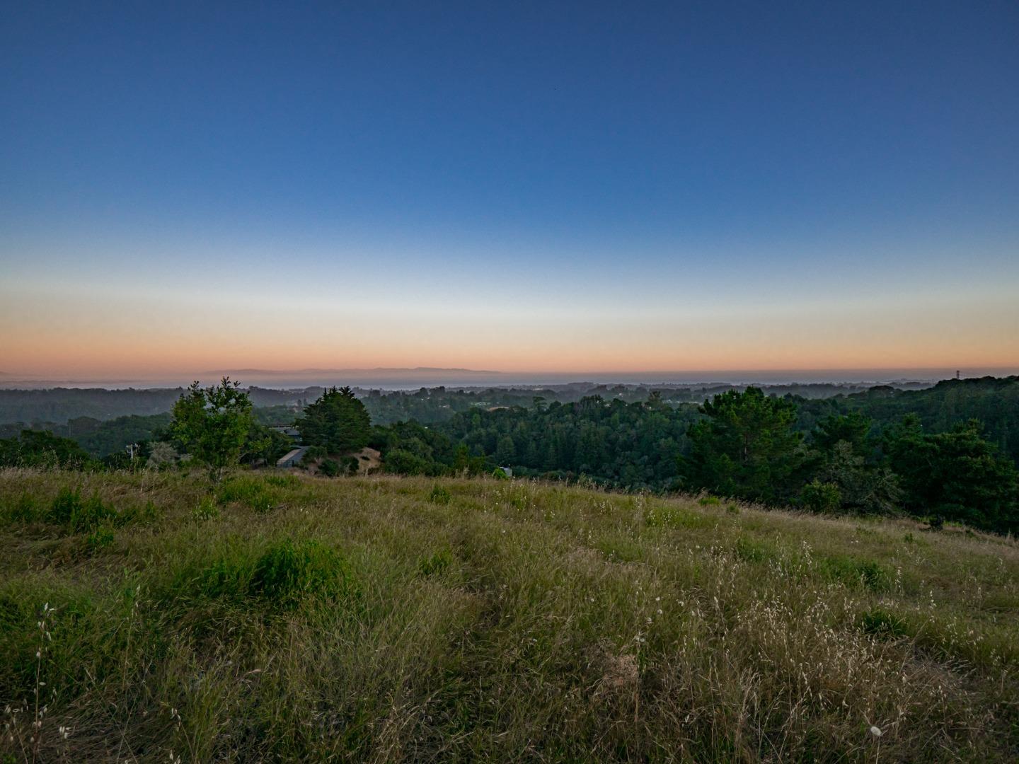 415 Muir Drive Soquel, CA 95073 - Photo 1 of 12 a view of a city with lush green forest