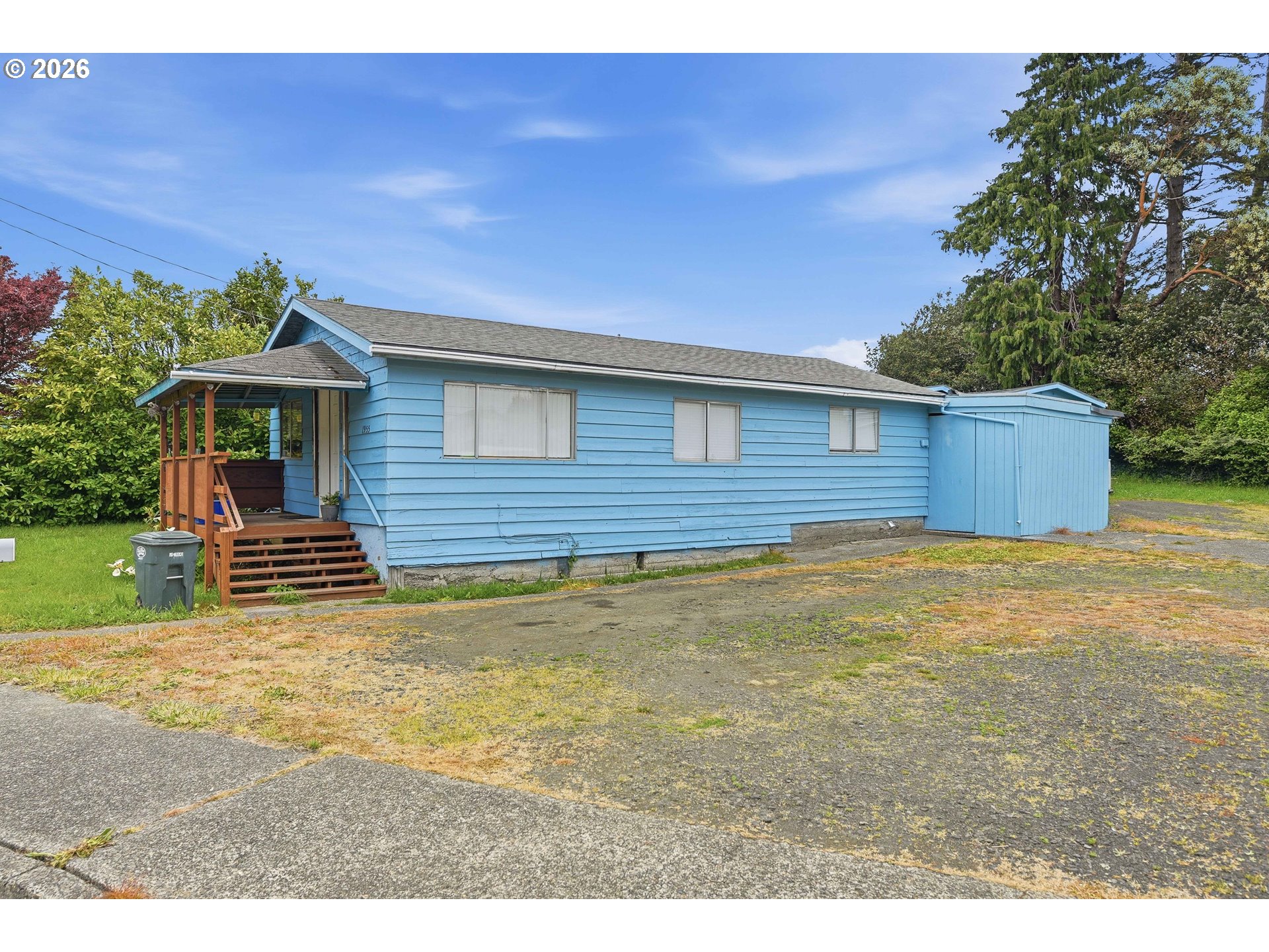1955 Maple Street North Bend, OR 97459 - Photo 6 of 48 a view of a house with a backyard