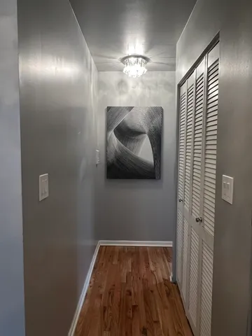 a spacious bathroom with a granite countertop sink and a mirror