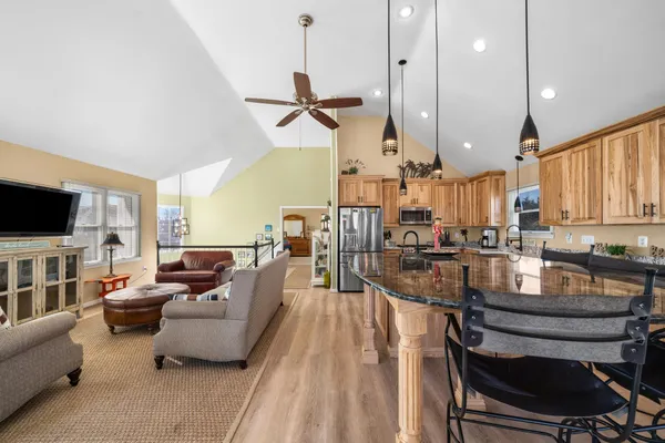 a living room with furniture and a glass door shower
