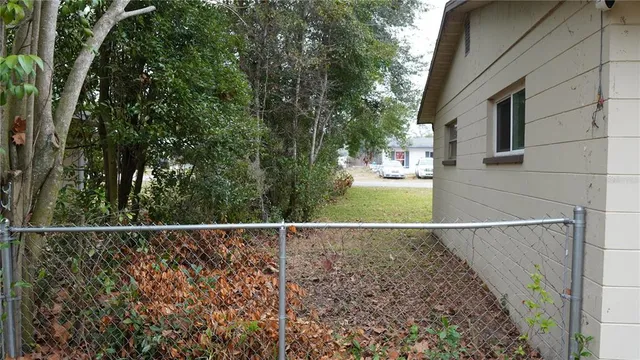 a backyard of a house with lots of green space