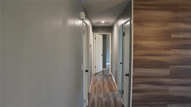 a view of gallery with wooden floor