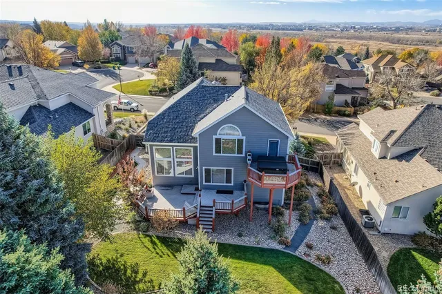 a view of a house with pool and chairs