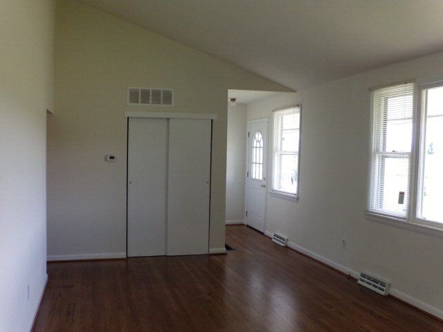 1659 Orchard Road Mount Jackson, VA 22842 - Photo 11 of 13 an empty room with wooden floor and windows