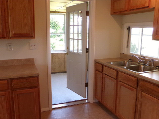 1659 Orchard Road Mount Jackson, VA 22842 - Photo 13 of 13 a kitchen with a sink cabinets and a window