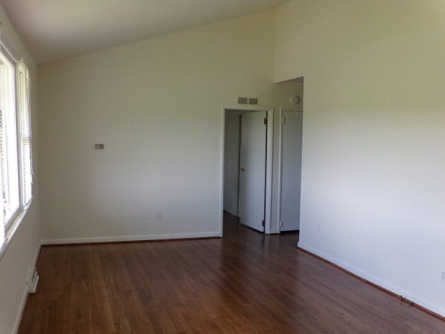 1659 Orchard Road Mount Jackson, VA 22842 - Photo 10 of 13 an empty room with wooden floor and windows