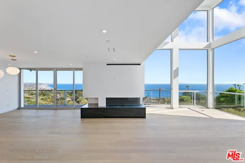 a view of a livingroom with a furniture wooden floor and window
