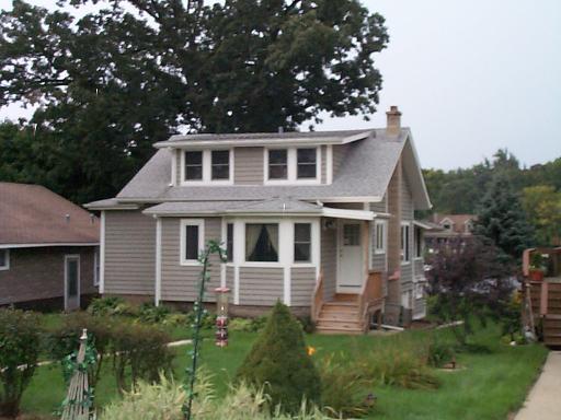 a aerial view of a house with a yard
