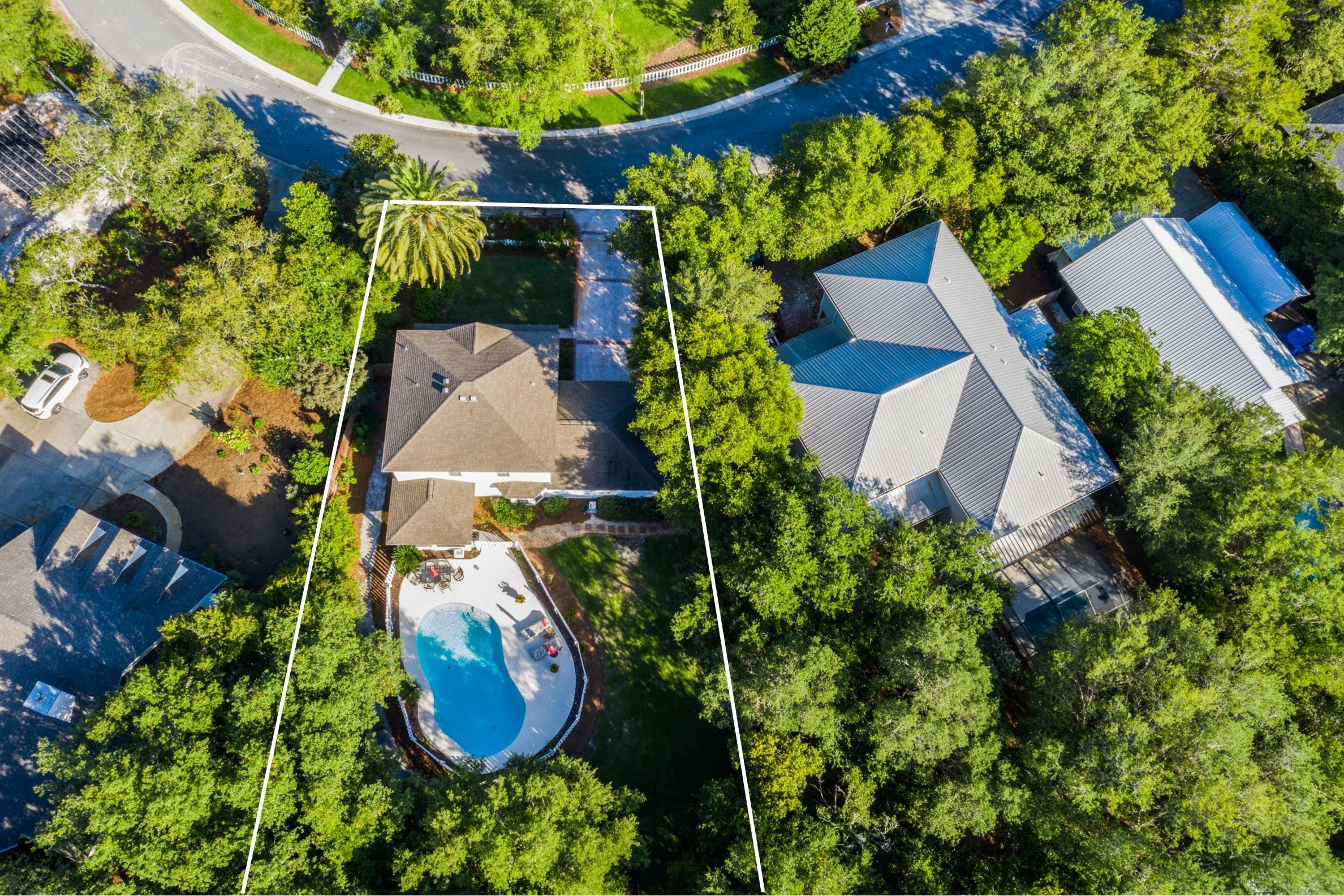 404 Seabreeze Circle Seacrest, FL 32461 - Photo 36 of 37 an aerial view of a house with garden space and street view