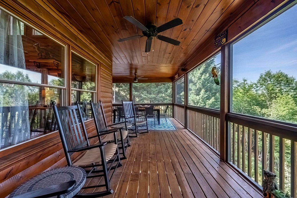 1722 Sun Rock Mountain Road Blue Ridge, GA 30513 - Photo 19 of 67 a view of a chairs and table in the balcony