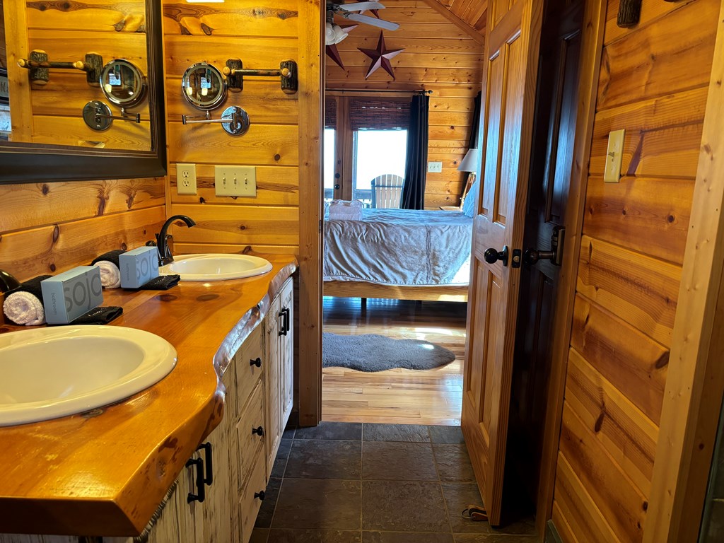 1722 Sun Rock Mountain Road Blue Ridge, GA 30513 - Photo 24 of 67 a bathroom with a tub sink and mirror
