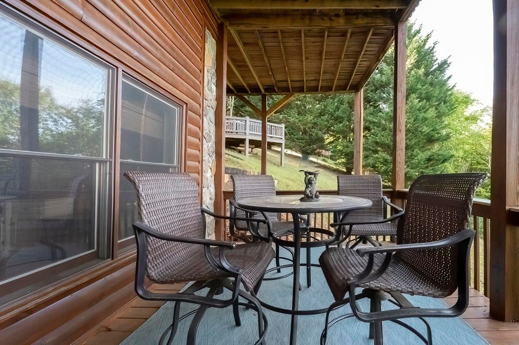 1722 Sun Rock Mountain Road Blue Ridge, GA 30513 - Photo 44 of 67 a view of an outdoor space with table and chairs