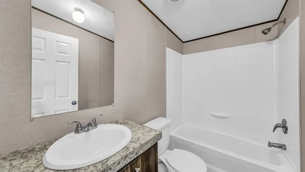 a bathroom with a sink toilet and bathtub