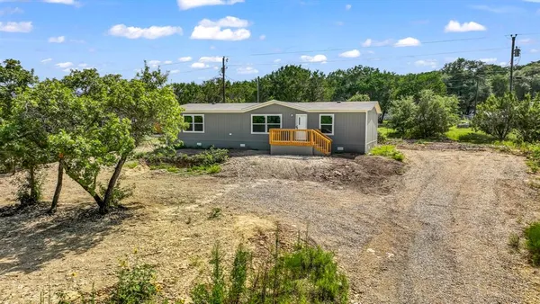 a house view with a backyard space