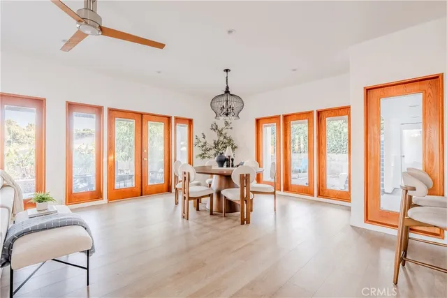 a view of a livingroom with furniture window and wooden floor