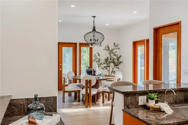 a dining room with furniture window wooden floor