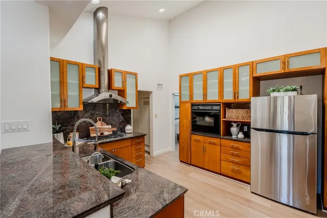 a living room with furniture pool table and chairs