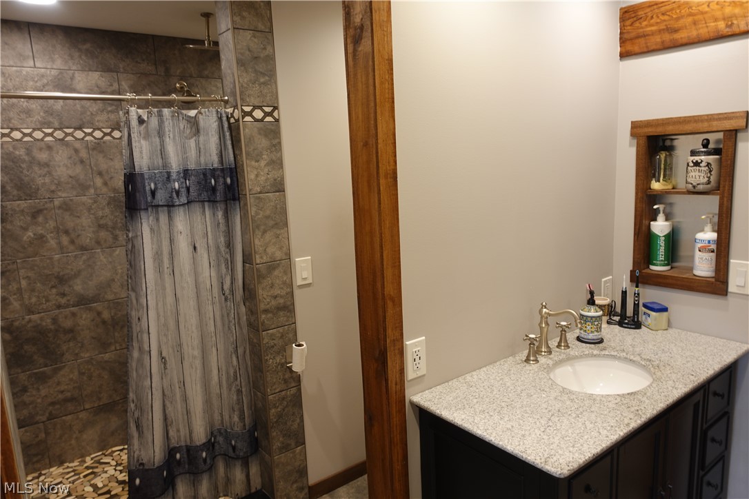 15488 Hatfield Road Rittman, OH 44270 - Photo 11 of 36 Bathroom with walk in shower and vanity