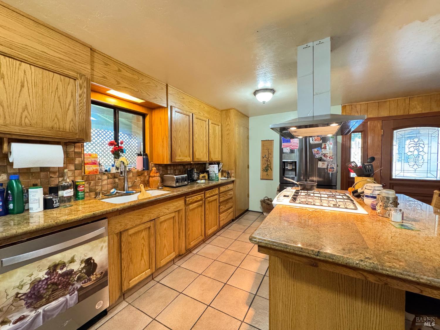 4400 Lake Ridge Road Ukiah, CA 95482 - Photo 5 of 78 a kitchen with stainless steel appliances kitchen island granite countertop a sink and cabinets