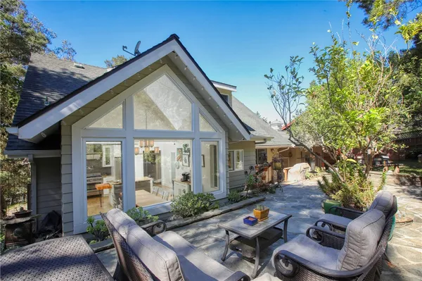 a view of a house with pool and wooden floor