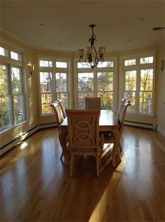 126 Summer Street, Unit 126 Watertown, MA 02472 - Photo 11 of 30 a living room with furniture and a large window