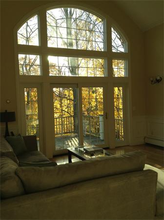 126 Summer Street, Unit 126 Watertown, MA 02472 - Photo 12 of 30 a living room with large windows