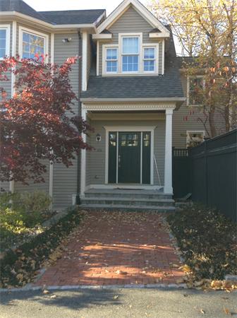 126 Summer Street, Unit 126 Watertown, MA 02472 - Photo 2 of 30 a front view of a house with garden