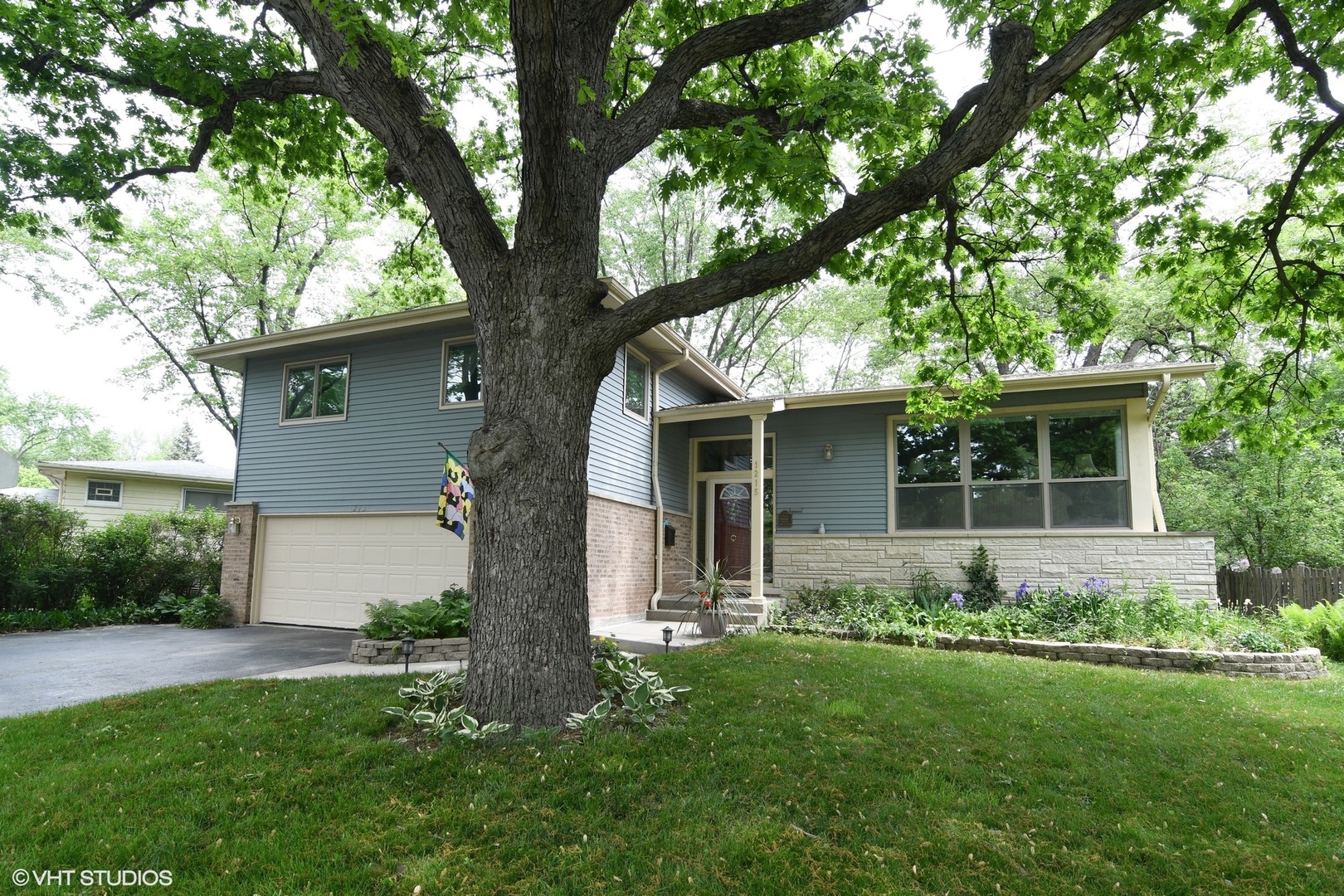 1215 Kenton Road Deerfield, IL 60015 - Photo 1 of 17 front view of house with a yard