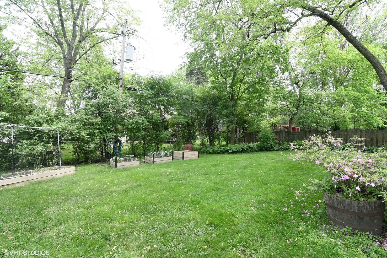 1215 Kenton Road Deerfield, IL 60015 - Photo 16 of 17 a view of green field with trees in the background