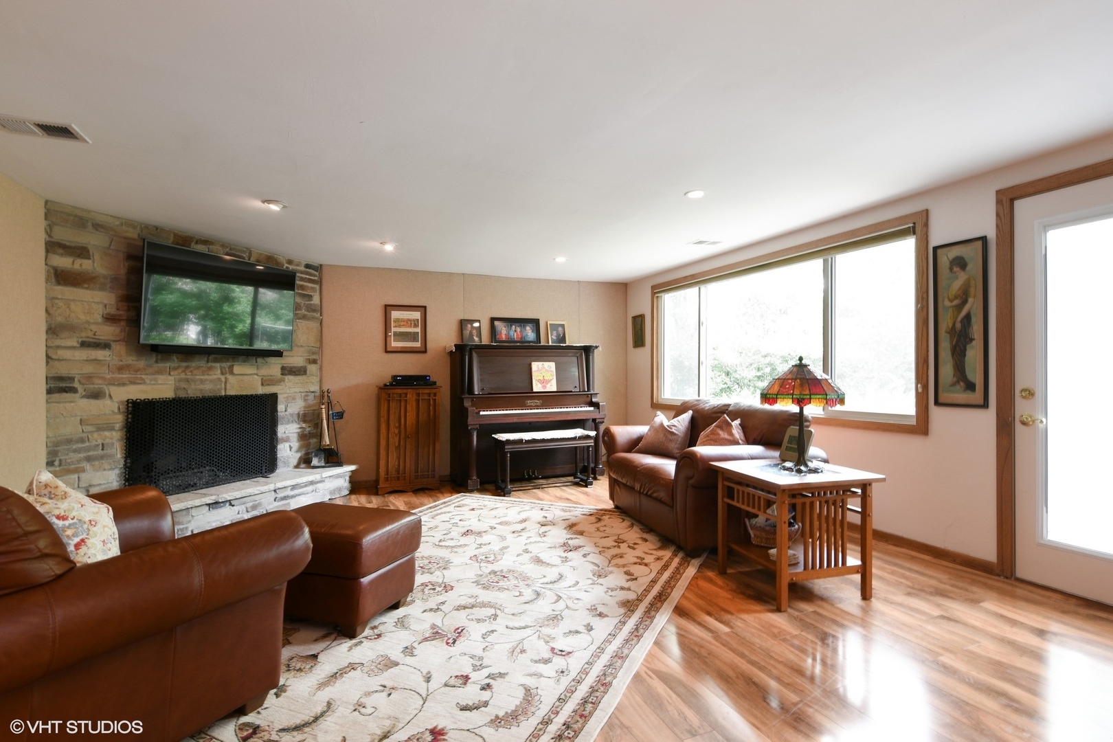 1215 Kenton Road Deerfield, IL 60015 - Photo 5 of 17 a living room with fireplace furniture and a flat screen tv