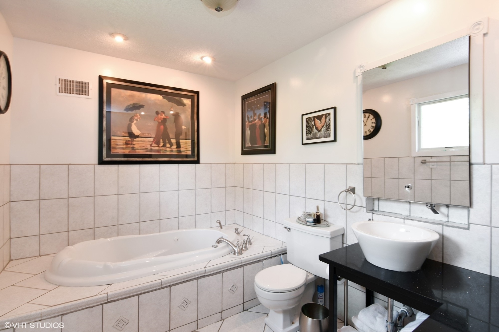 1215 Kenton Road Deerfield, IL 60015 - Photo 7 of 17 a bathroom with a sink mirror and toilet