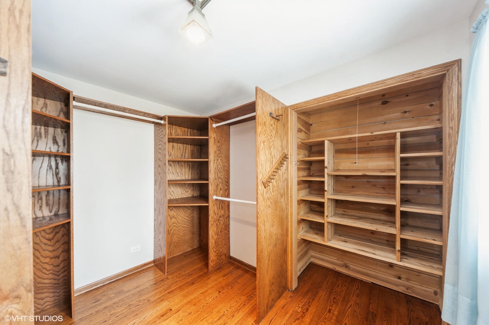 1215 Kenton Road Deerfield, IL 60015 - Photo 8 of 17 a view of an empty room with a window and wooden floor