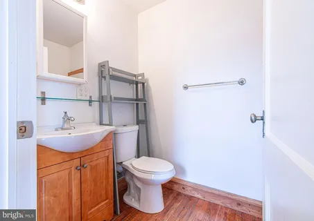 a bathroom with a sink toilet and vanity