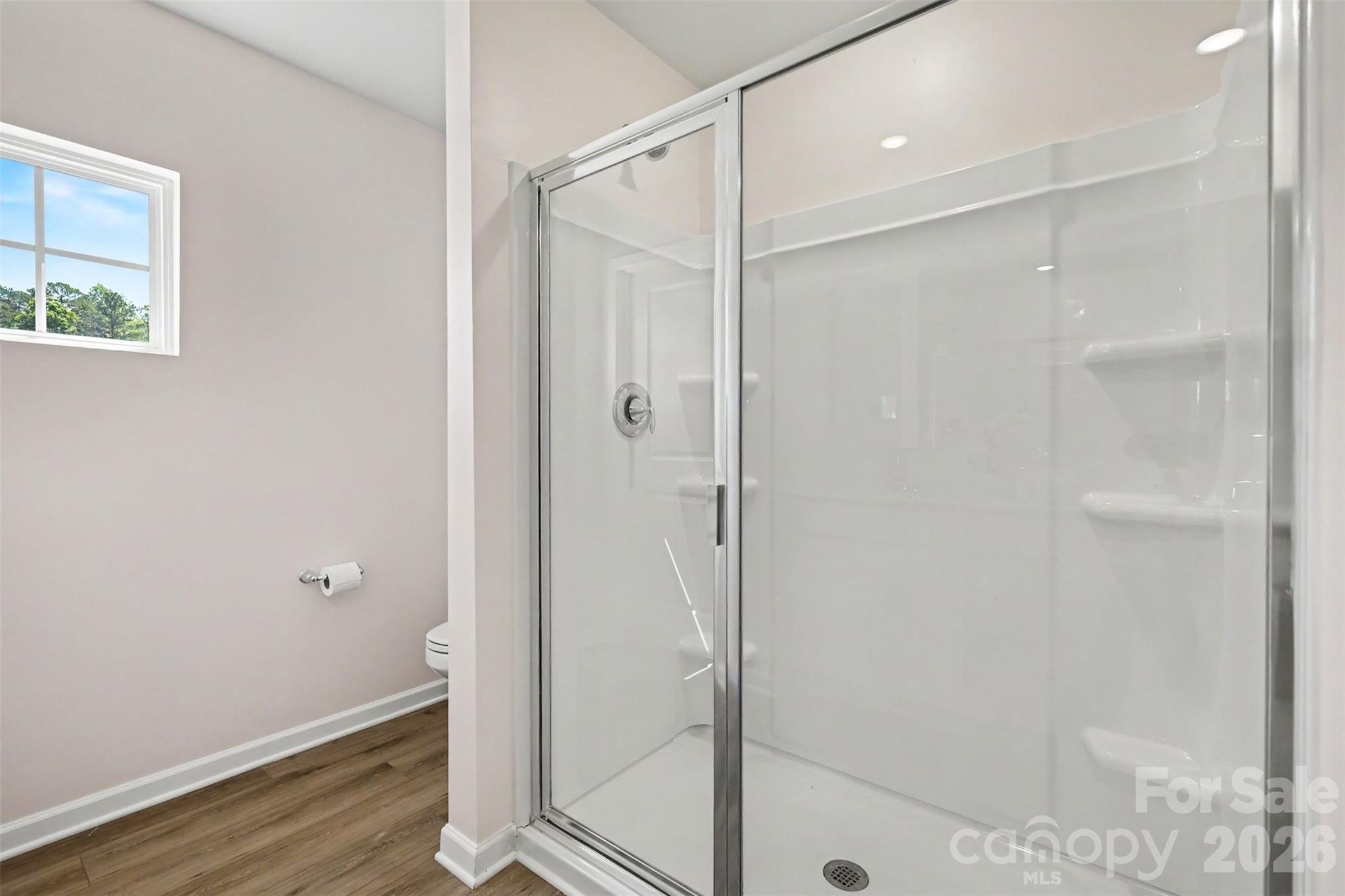 633 Mile Crk Road Edgemoor, SC 29712 - Photo 21 of 26 a bathroom with a glass shower door