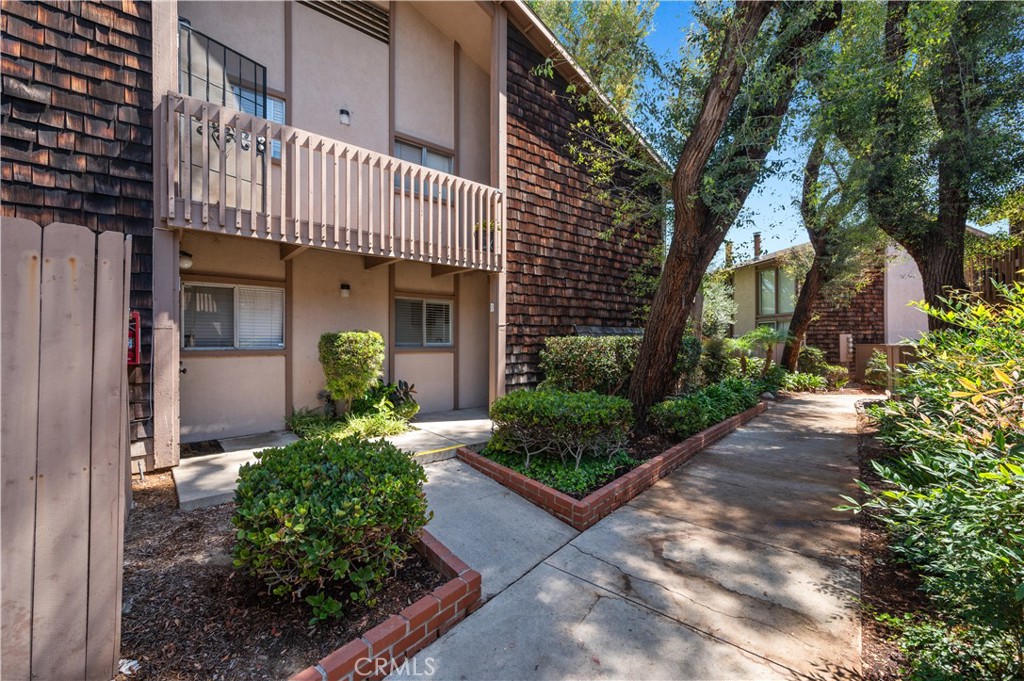 1044 Cabrillo Park Drive, Unit B Santa Ana, CA 92701 - Photo 3 of 49 a front view of a house with garden